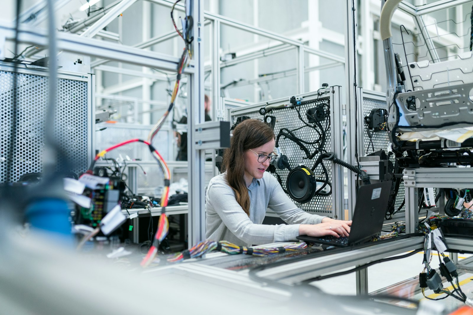 Engineer working on a manufacturing test bench