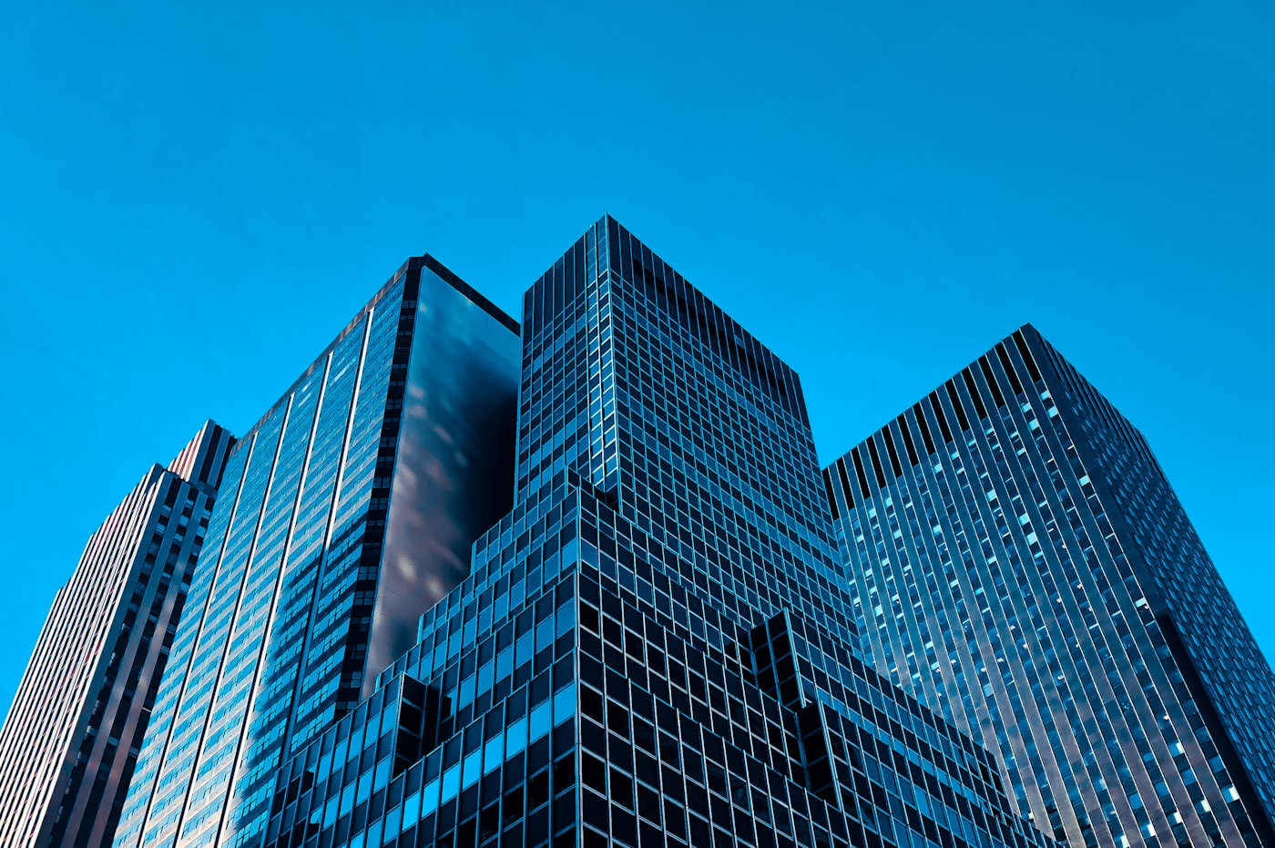 Blue glass skyscraper seen from below