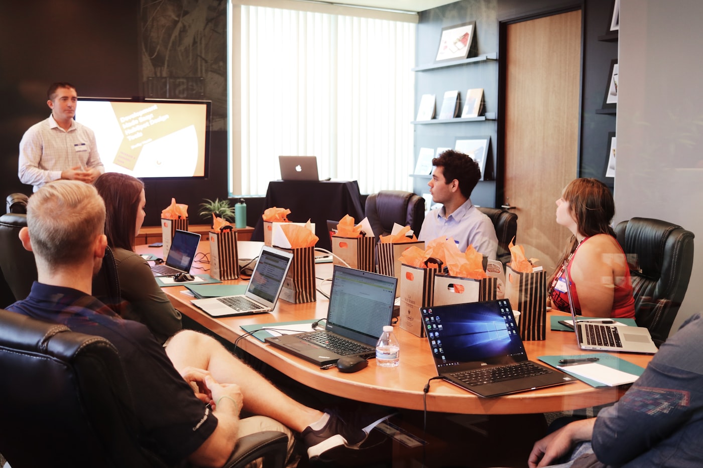 Boardroom meeting with laptops open