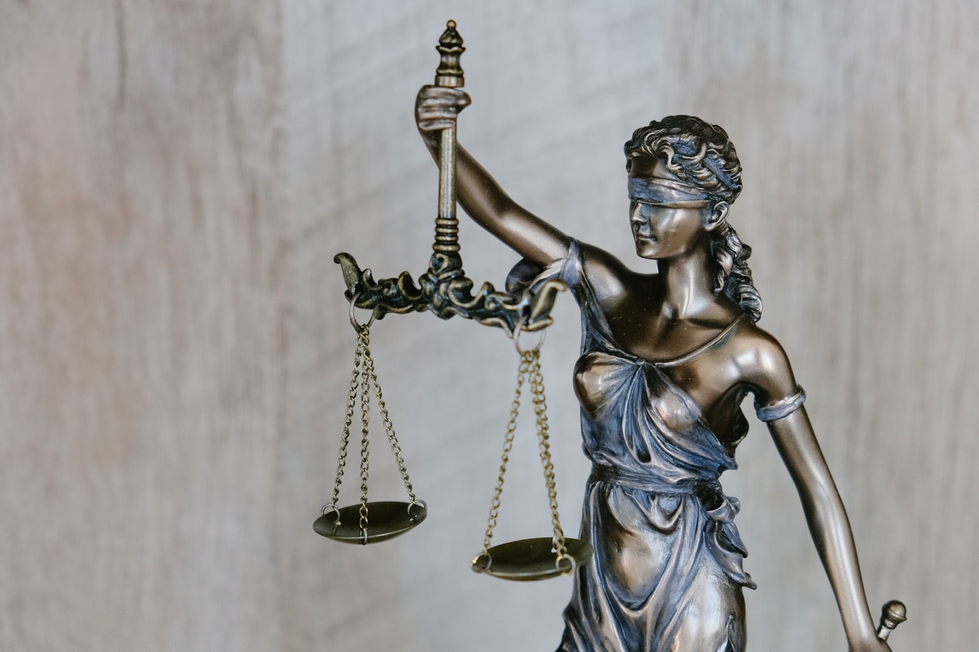 Statue of Lady Justice holding balanced scales
